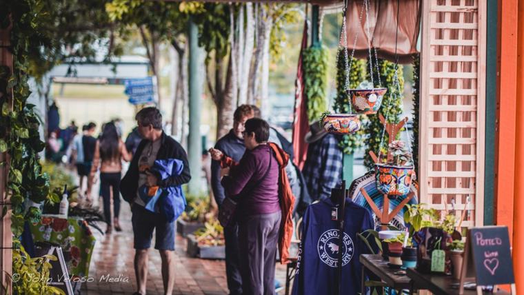 Market stalls along a busy footpath