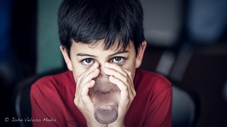 Portrait of a boy drinking from a glass