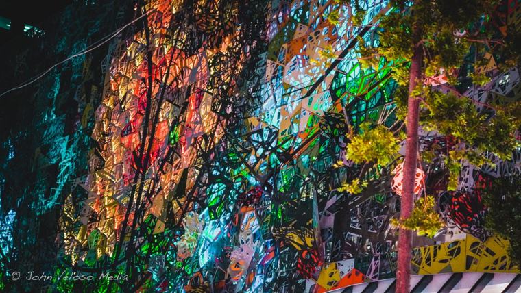 Colourful mural seen through the trees