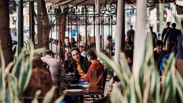 Diners at a busy outdoor cafe